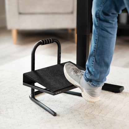 Adjustable footrest designed for workers who sit or stand all day with little ergonomic support.