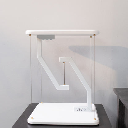 Floating speakers stand for improved sound and aesthetic appeal.