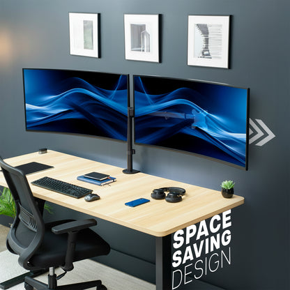 Modern office desk setup with dual monitors on telescoping arm monitor mount, desk accessories, a chair, and decor on a gray wall.