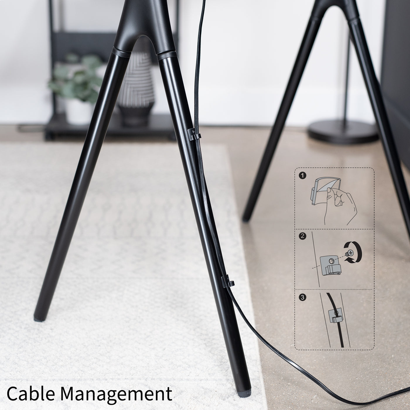 Sturdy easel studio TV stand with integrated cable management.
