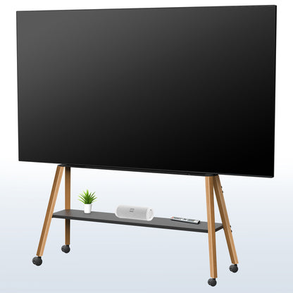 A large black flat-screen TV on a wooden rolling stand with a lower shelf holding a small plant, a white speaker, and a remote, shown against a light gray gradient background.
