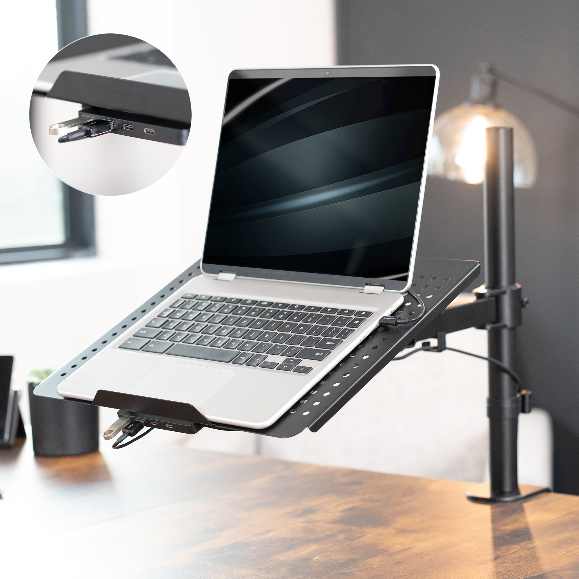 Height adjustable clamp-on laptop stand with USB ports, ventilation, and cable management.