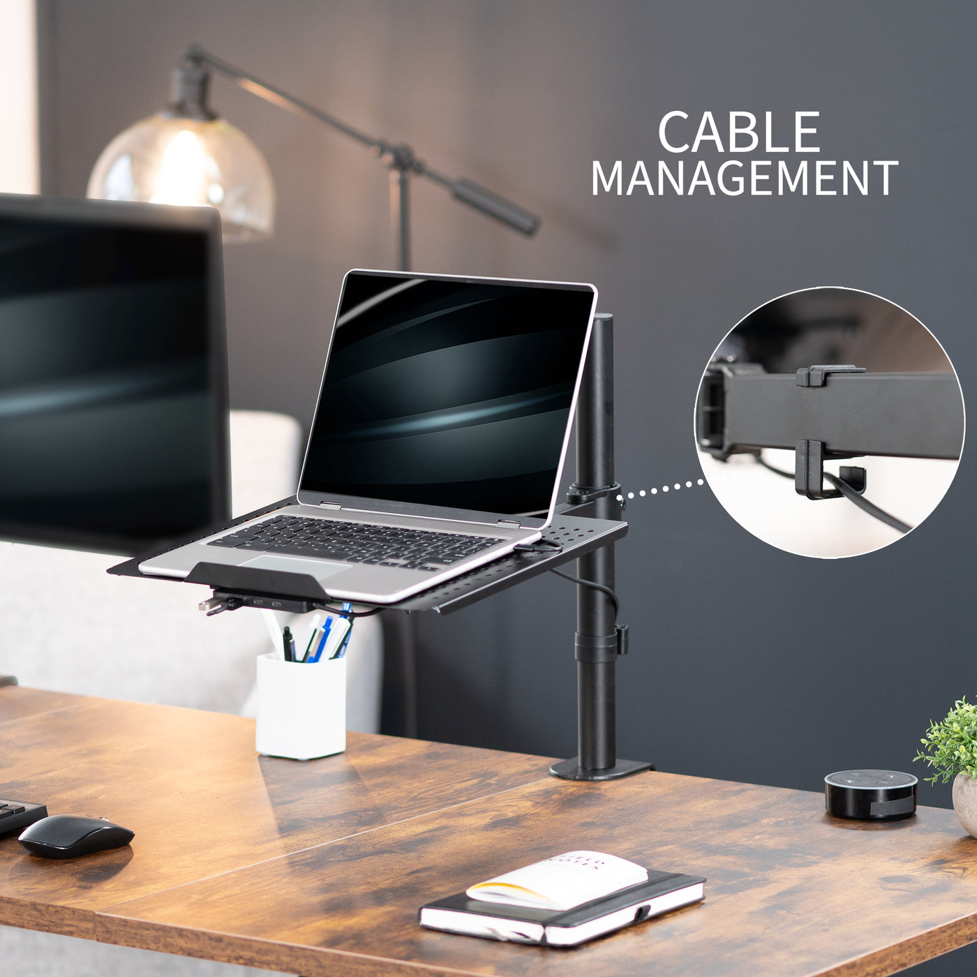 Height adjustable clamp-on laptop stand with USB ports, ventilation, and cable management.
