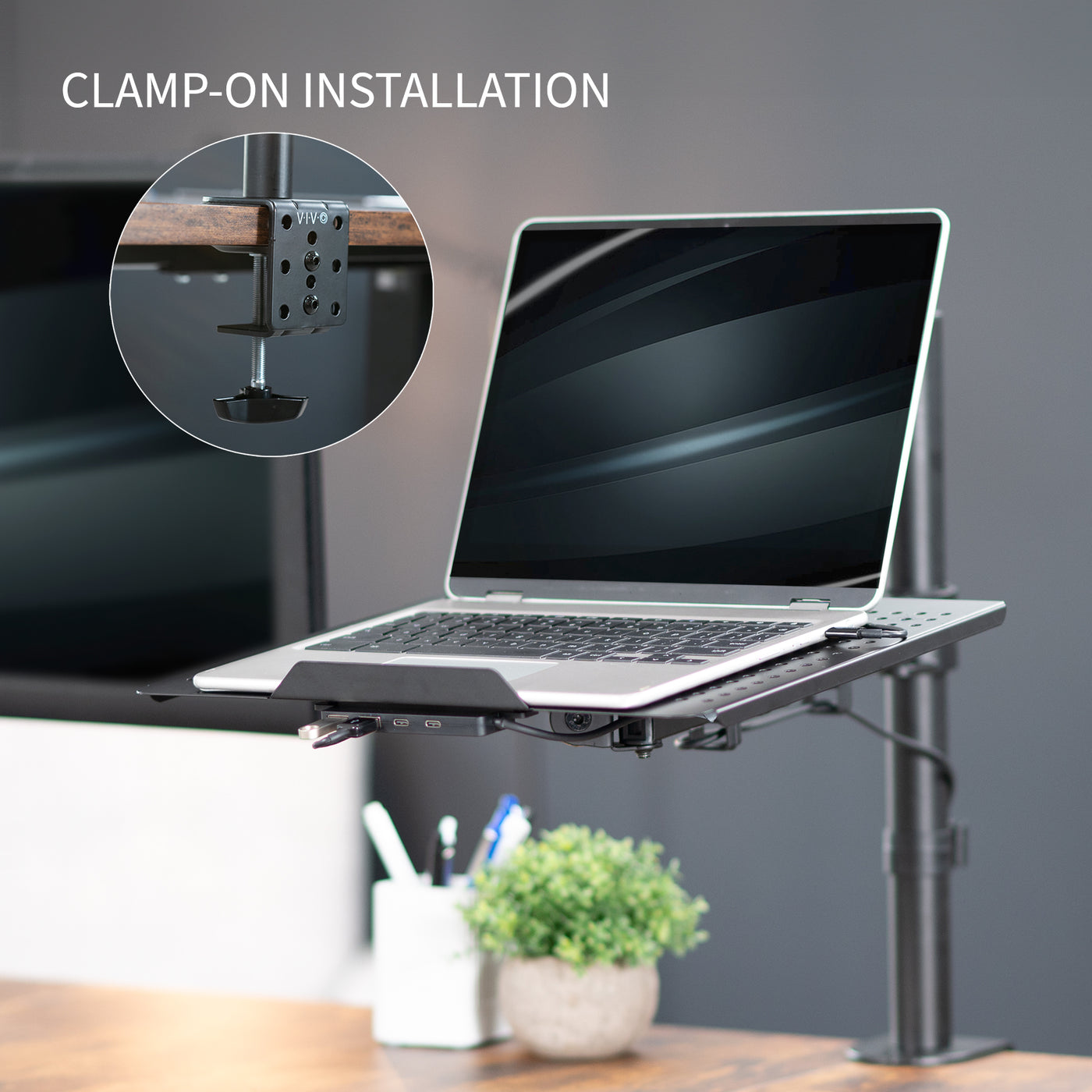 Height adjustable clamp-on laptop stand with USB ports, ventilation, and cable management.