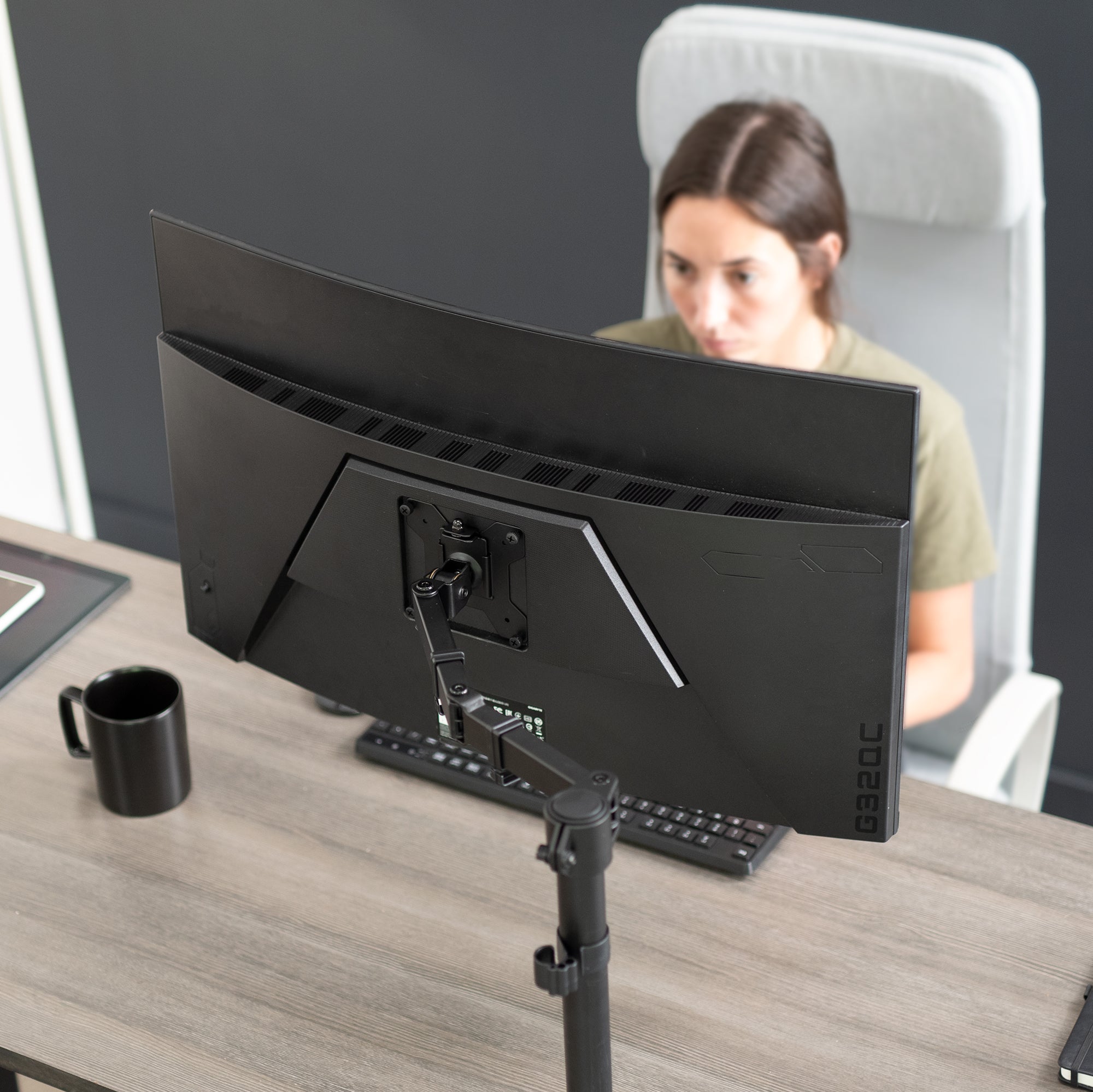 Single monitor desk mount from VIVO with articulation and cable management.