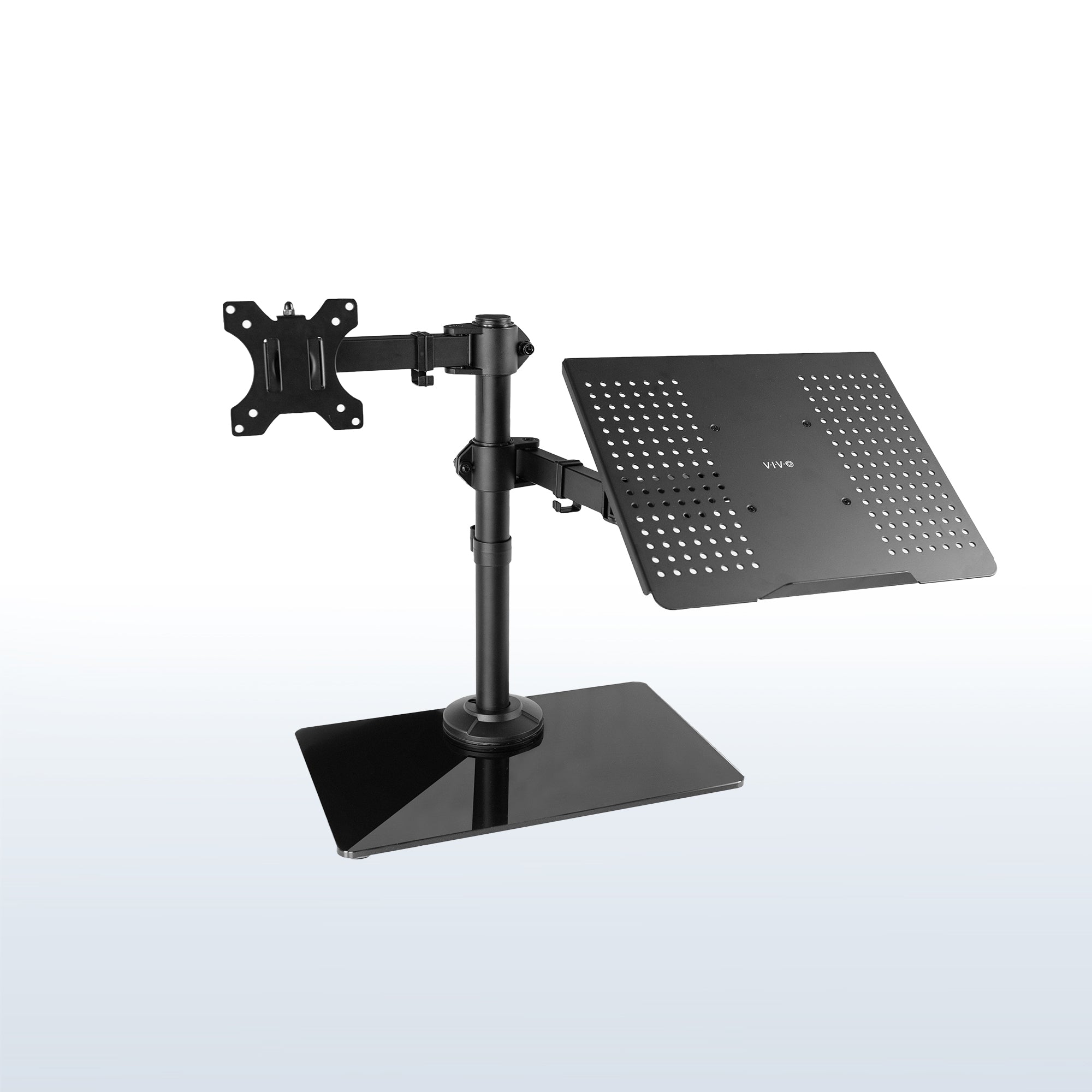 Freestanding monitor and laptop stand with elegant glass base for dual screen viewing and ergonomic placement.