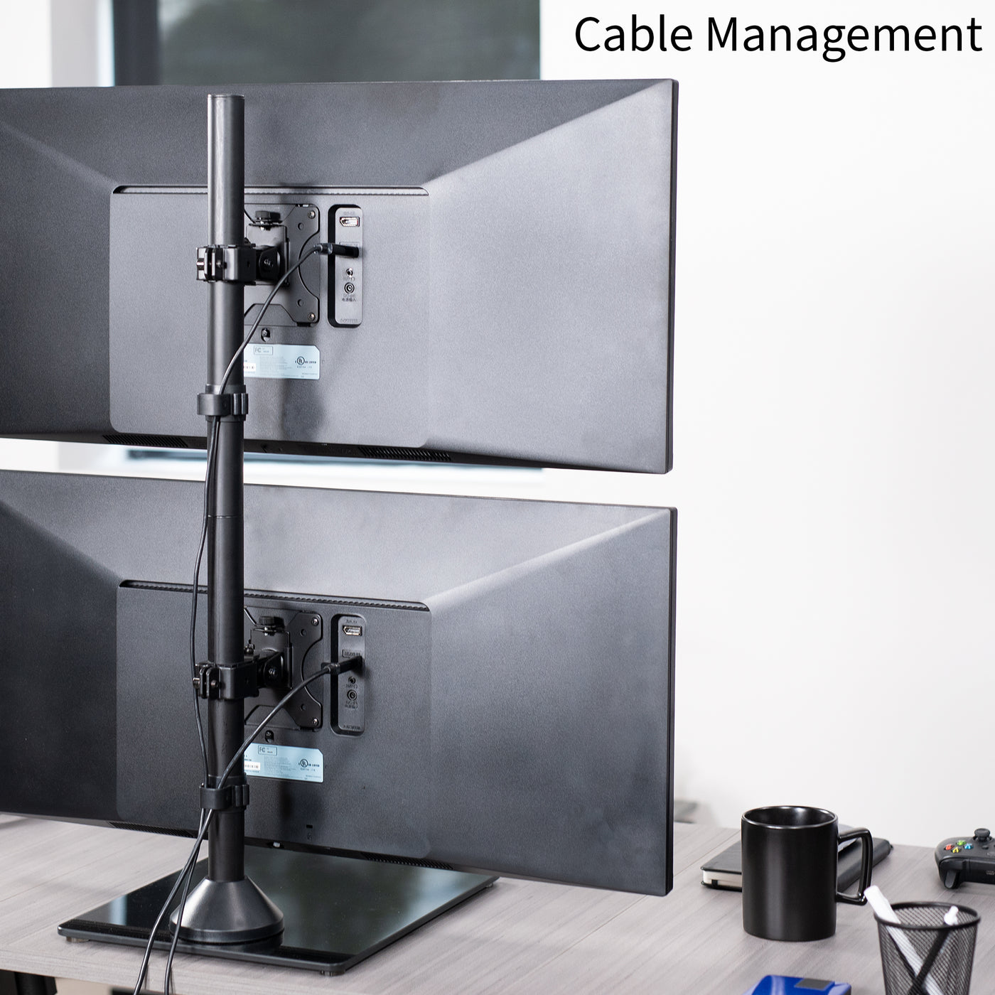 Tall dual monitor desk stand for stacked array with sturdy glass base and integrated cable management.
