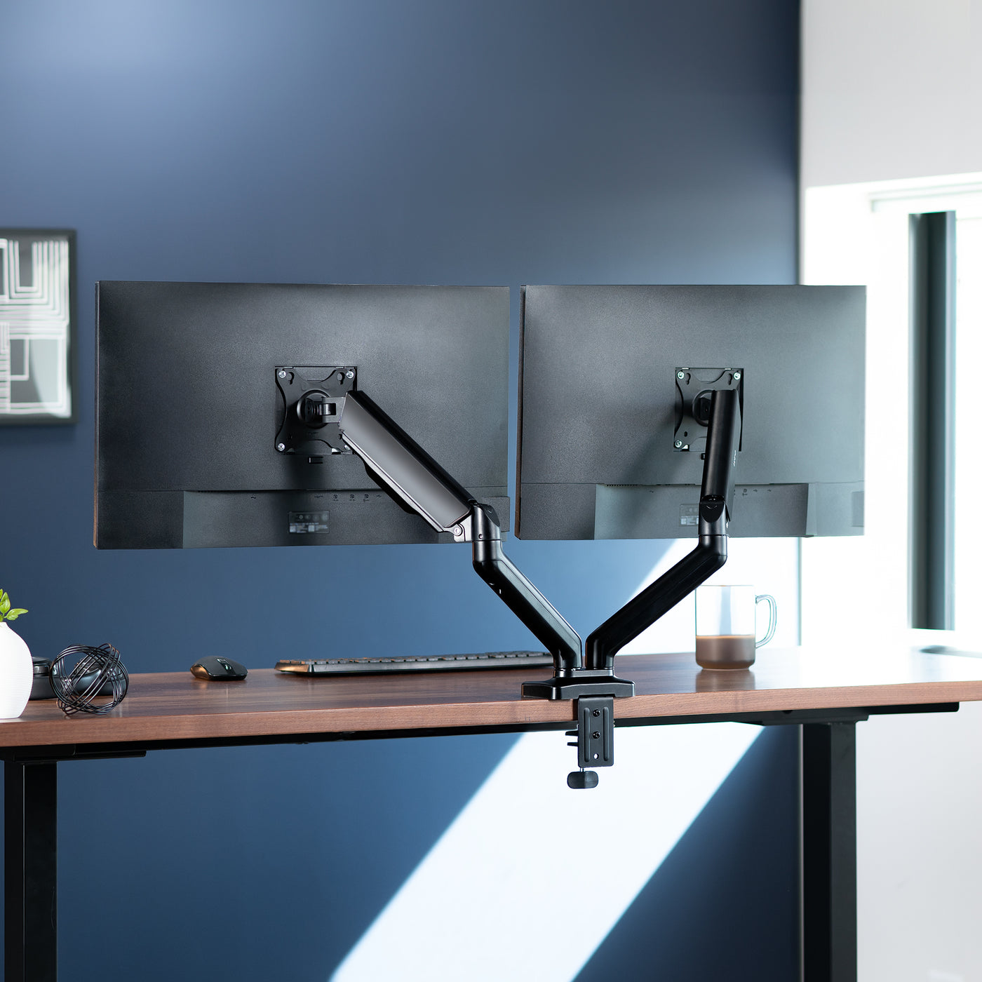 Sturdy adjustable pneumatic arm dual monitor ergonomic desk stand for office workstation with USB ports.