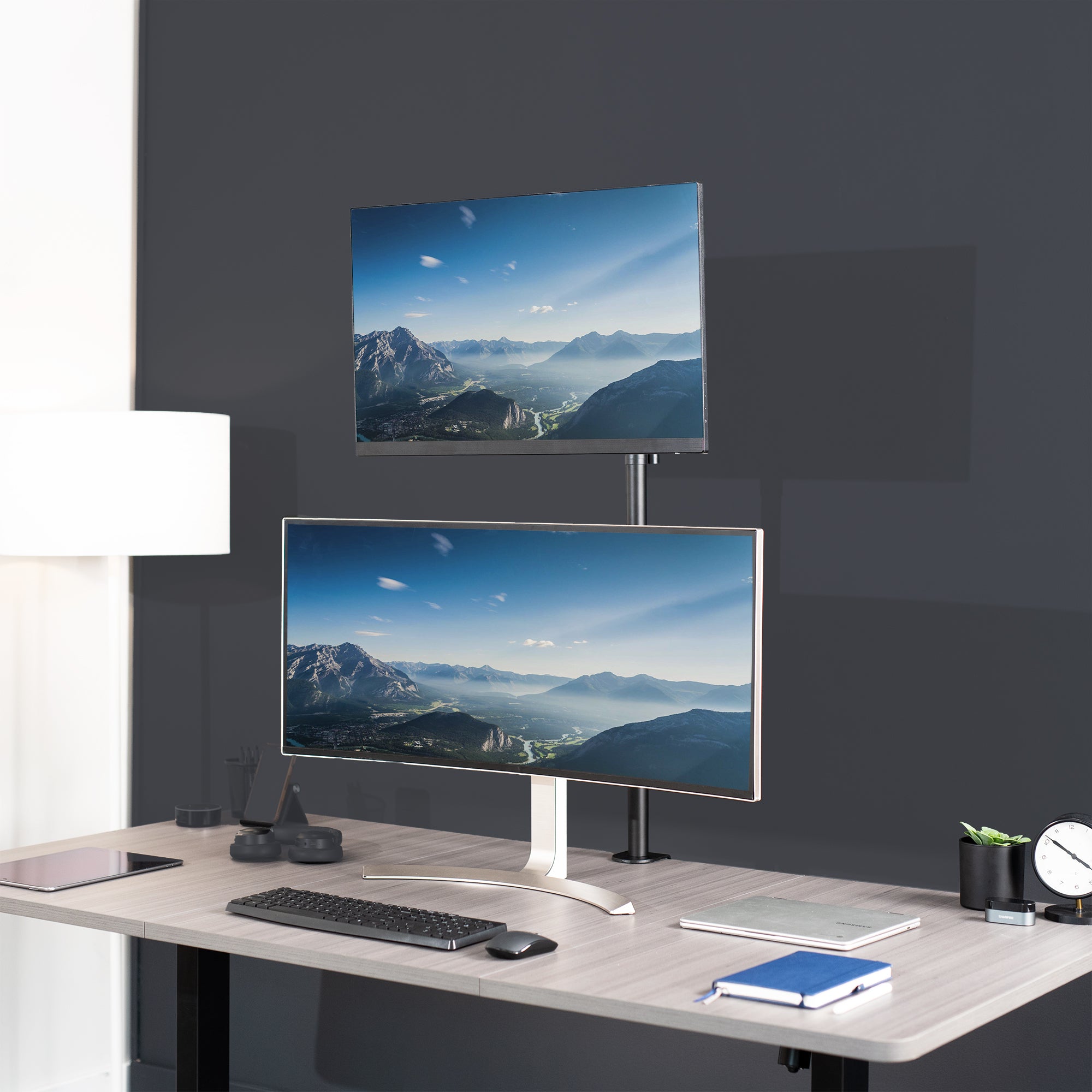 Extra tall desk mount for single monitor provides sit or stand application for the user.