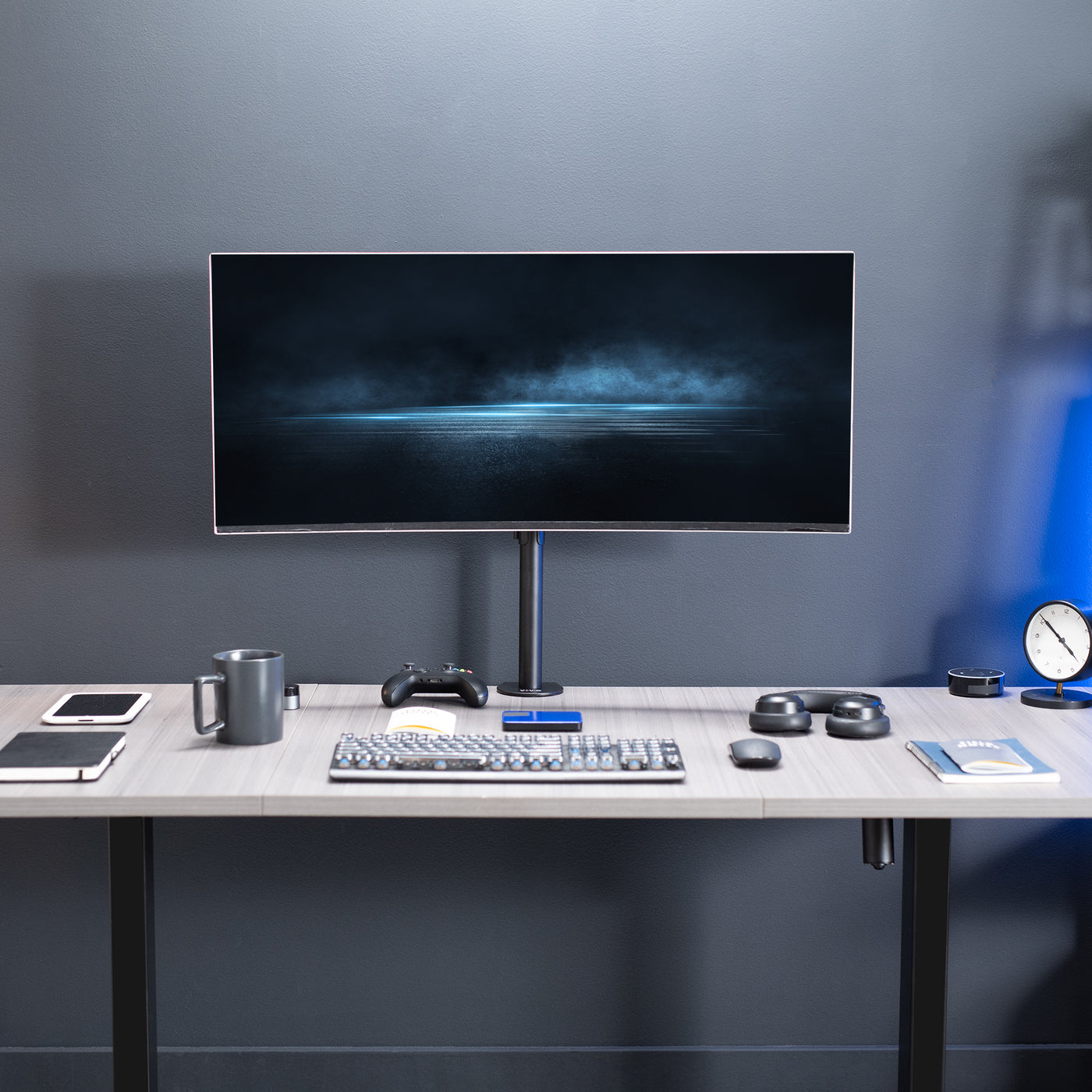 Single ultrawide monitor mount for large screens to be held at a comfortable viewing angle.