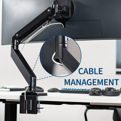 Cable management that runs down the arm and down desks through the C-clamp.