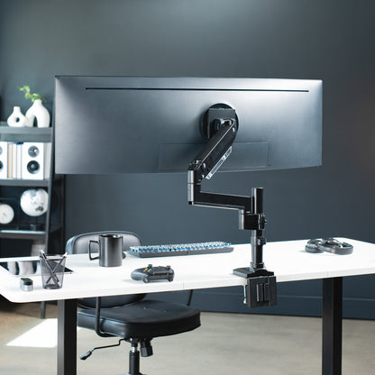 Sturdy adjustable pneumatic arm single ultrawide monitor ergonomic desk mount for office workstation.