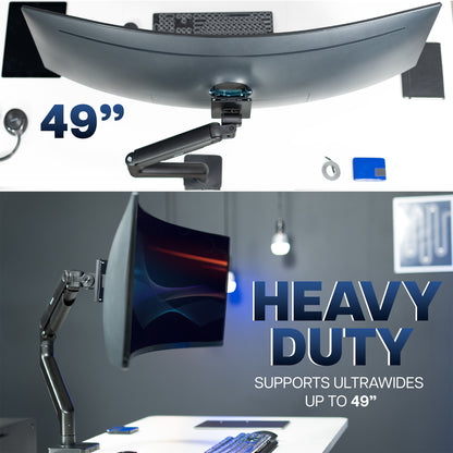 A single ultrawide computer monitor attached to a pneumatic arm desk mount with text.