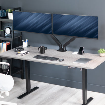 Adjustable pneumatic dual monitor desk mount for ultrawide monitors.