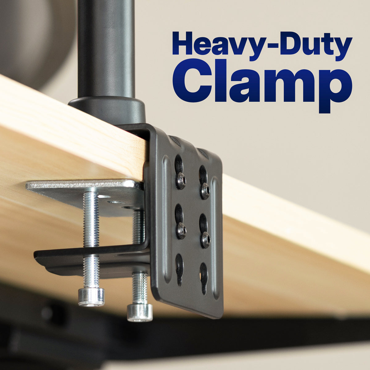 Close-up of a heavy-duty metal clamp attached to a light wood surface, with large blue text reading 'Heavy-Duty Clamp' in the upper right.