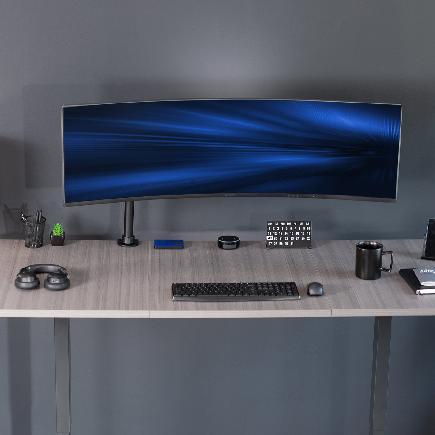 Single Ultrawide Monitor Desk Mount elevates ultra wide monitors to a comfortable viewing angle. The advanced tilt joint is designed to hold heavy screens securely.