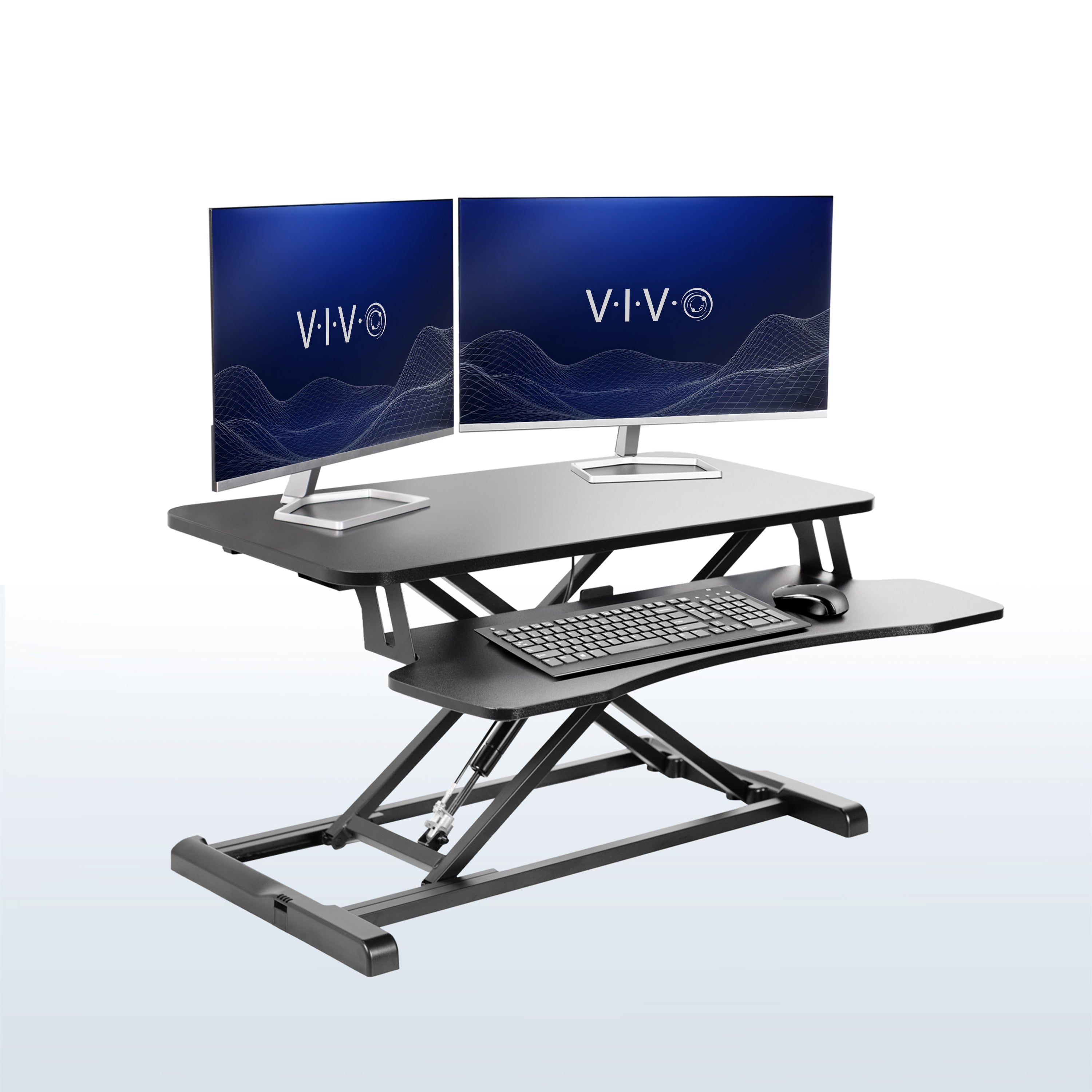 Sturdy height adjustable 2-tiered desk riser for ergonomic office workstation in  office setting. 
