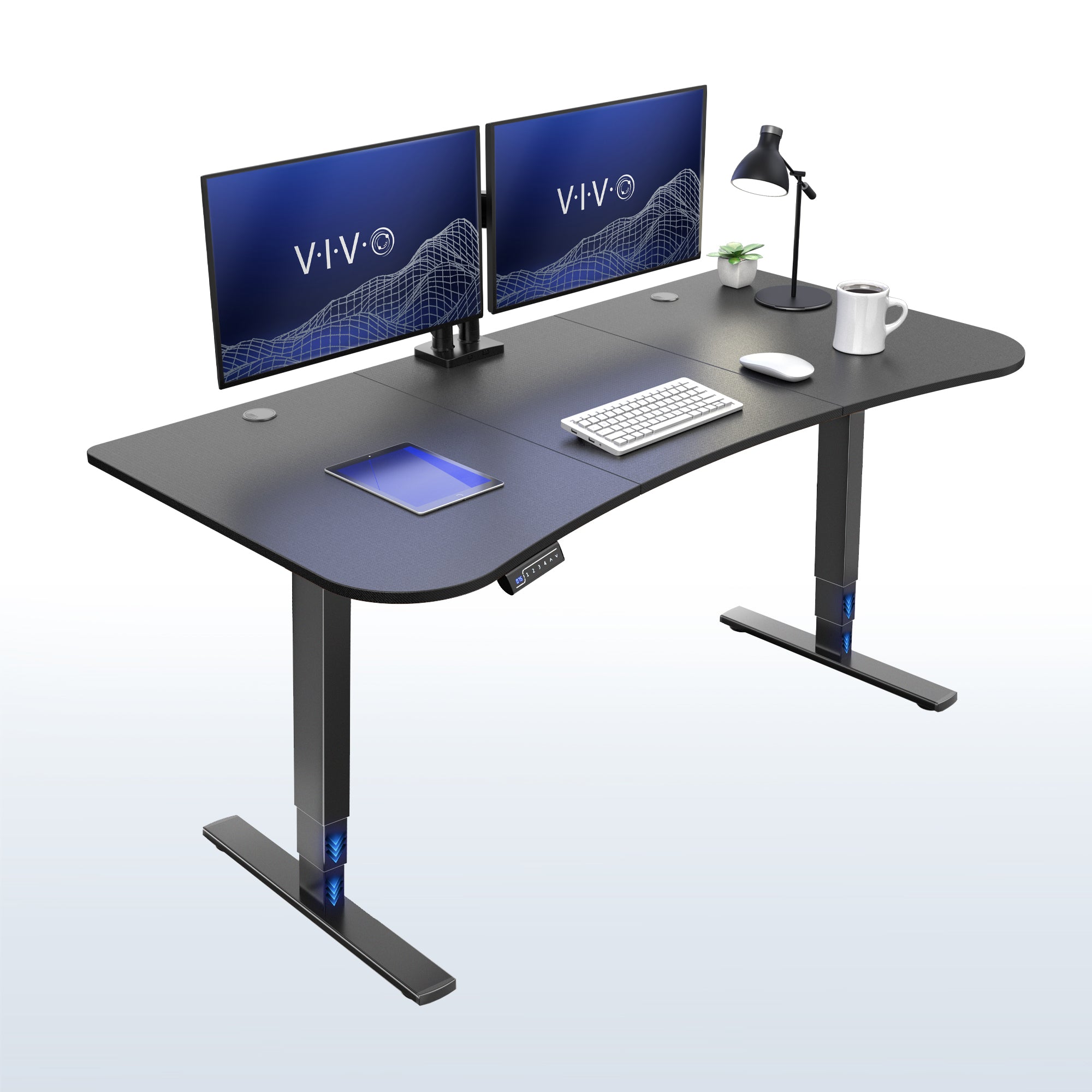 63” x 32” Electric Height Adjustable Stand Up Desk. Features a built-in power strip.