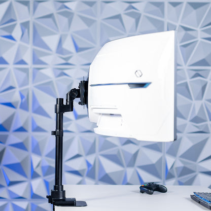 Large ultrawide monitor on a desk with a geometric blue wall background