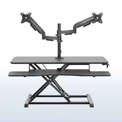 42 inch height adjustable desk riser with articulating mechanical dual monitor mount.