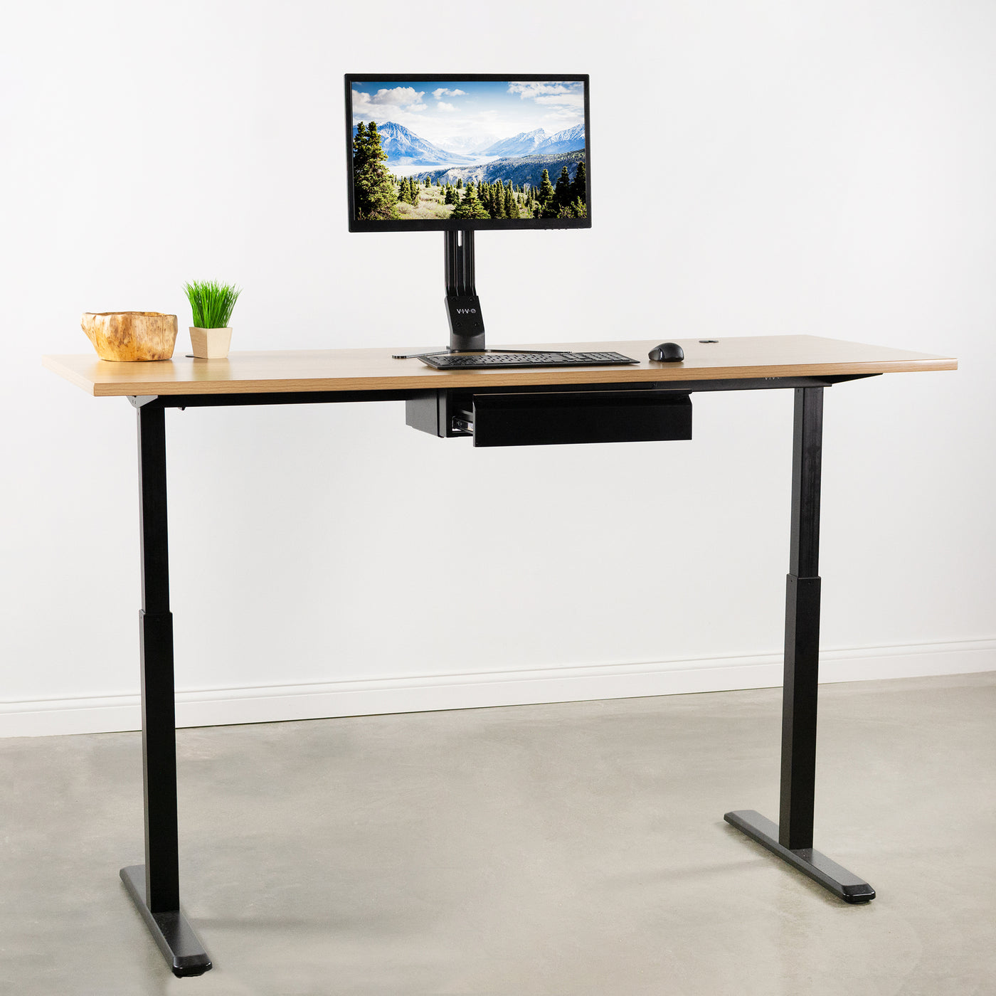 Standing desk with a mounted desk organizer.