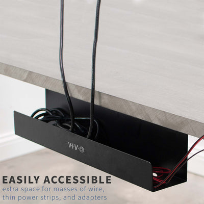 Easily accessible tray holding adapters, powerstrips, and copious quantities of wire.