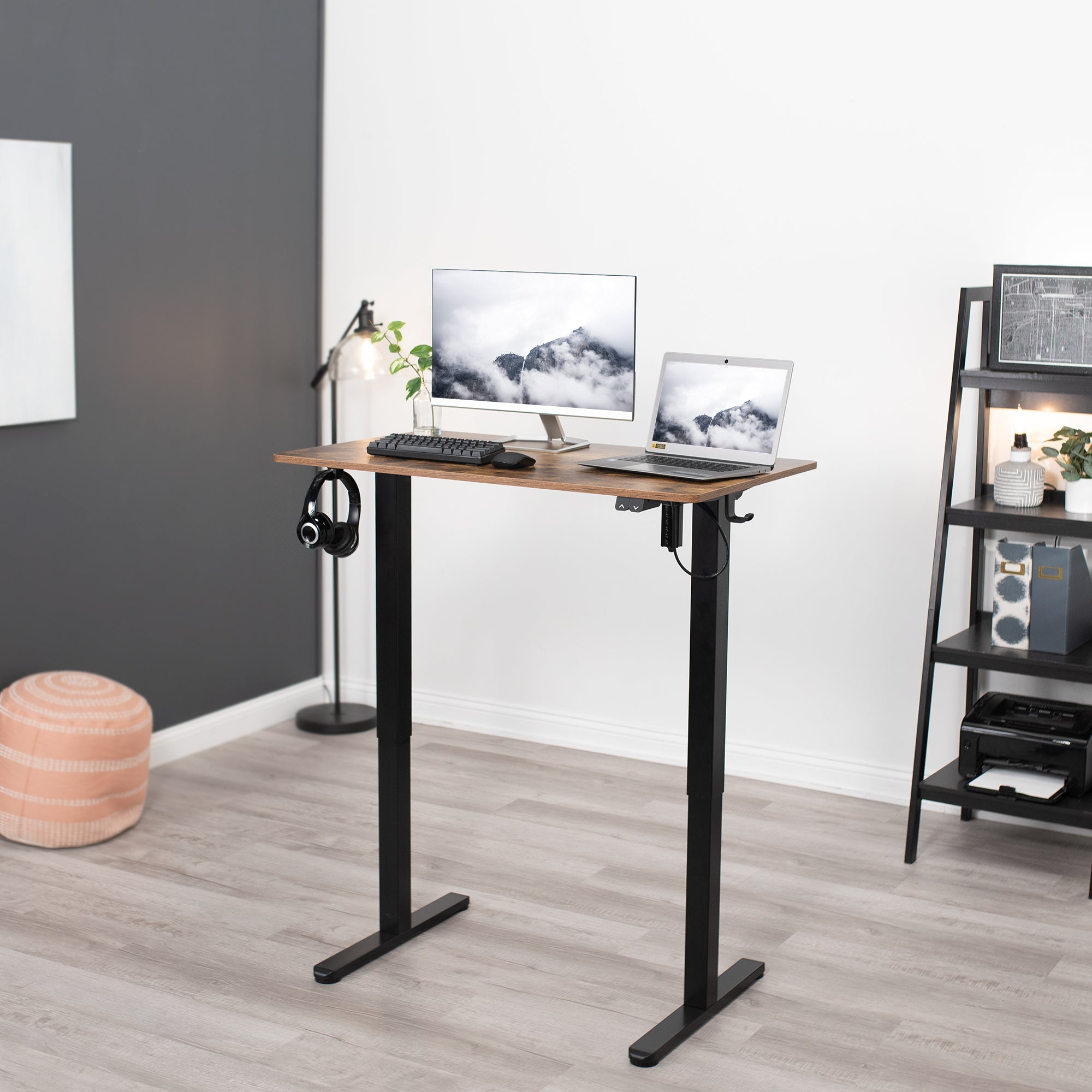 Heavy-duty rustic electric height adjustable desktop workstation for active sit or stand efficient workspace.