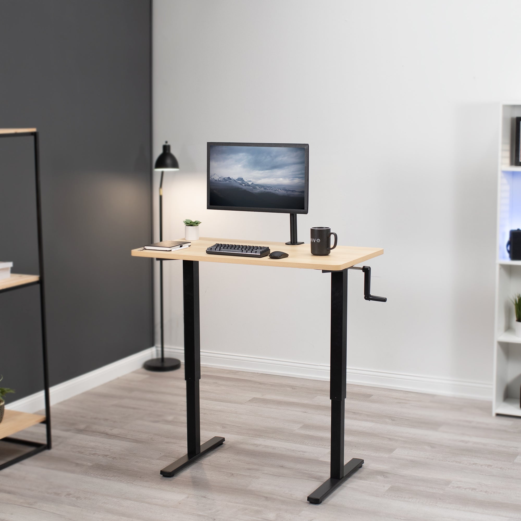 Manual hand crank height adjustable desk for active sit to stand workstation.