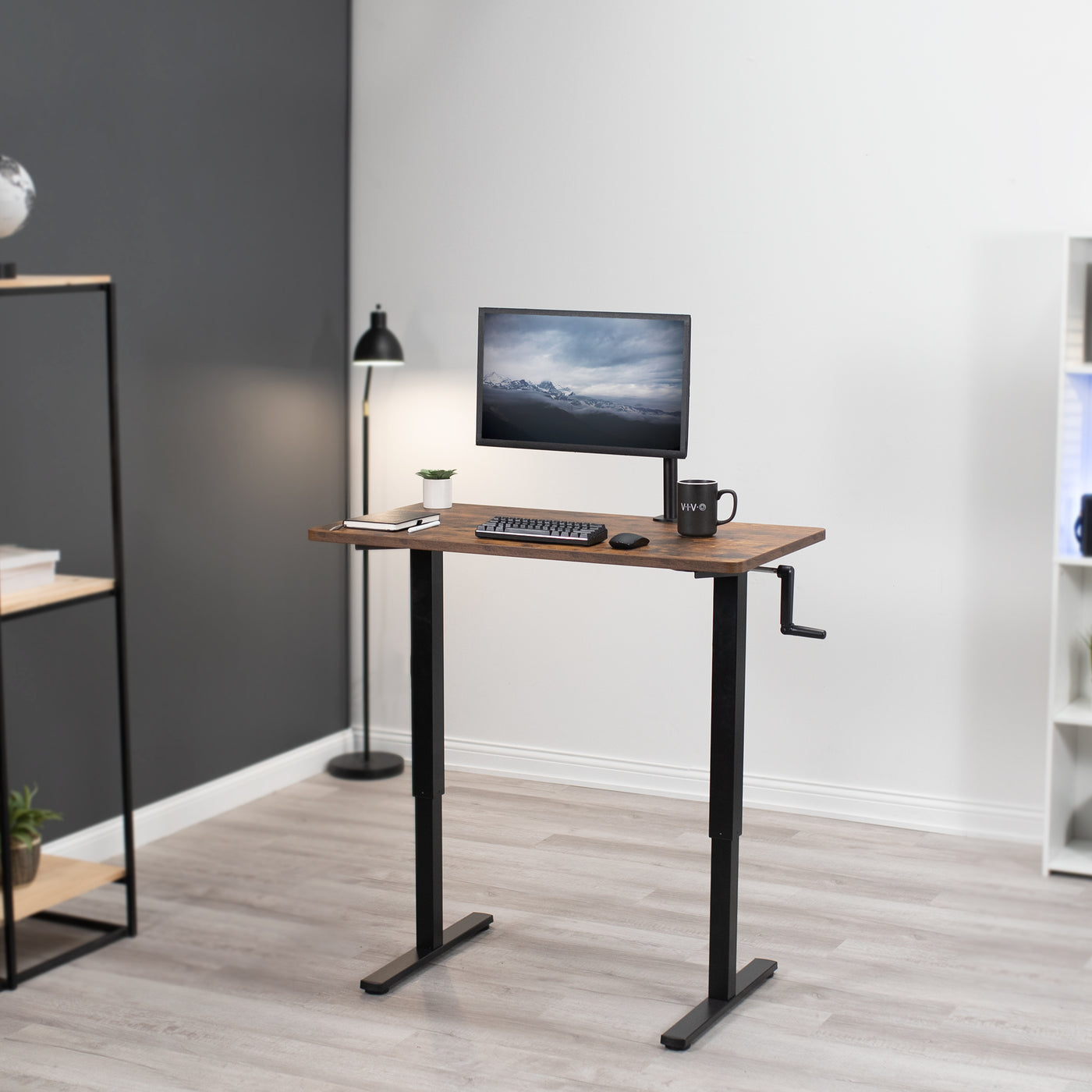 Manual hand crank rustic height adjustable desk for active sit to stand workstation.