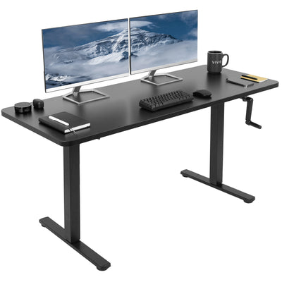Large black manual height adjustable desk with side crank handle.