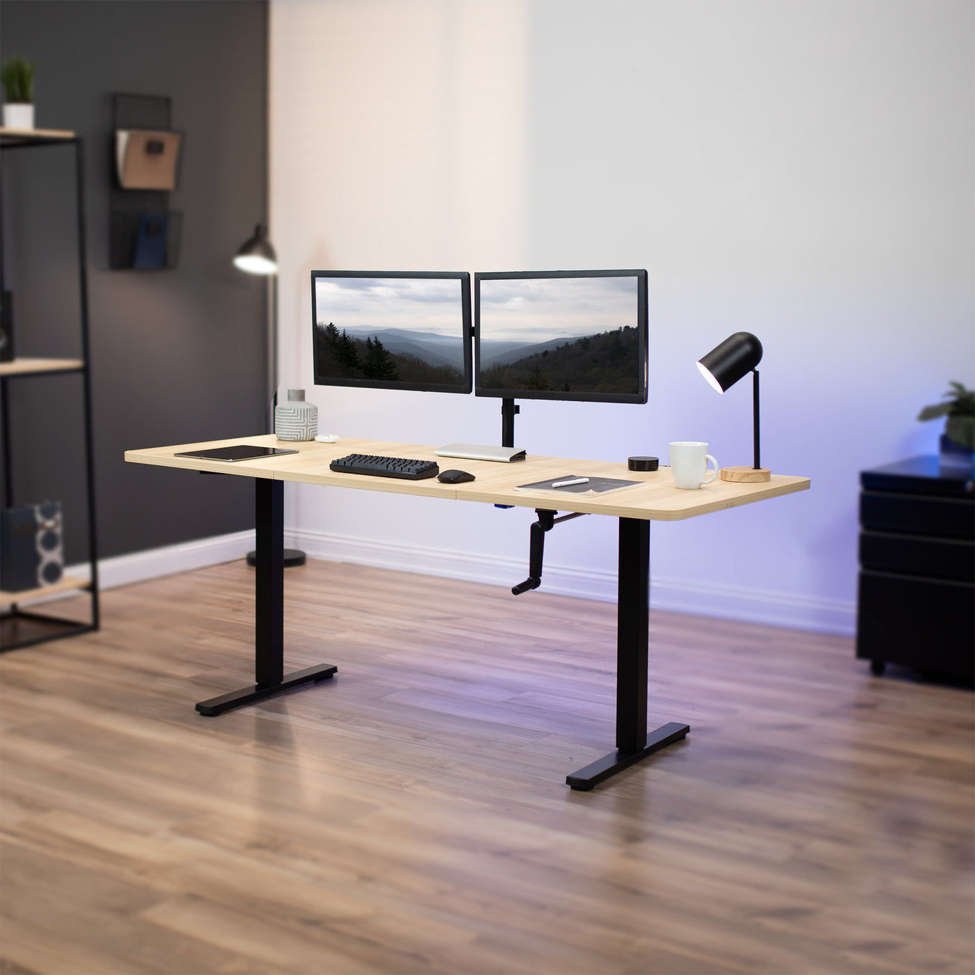Wide surface sturdy sit or stand active workstation with adjustable height using manual hand crank.