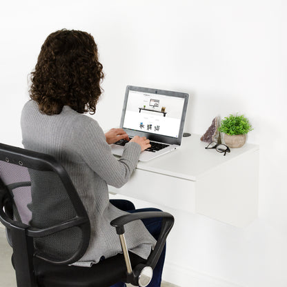 Floating wall mount desk with drawer.