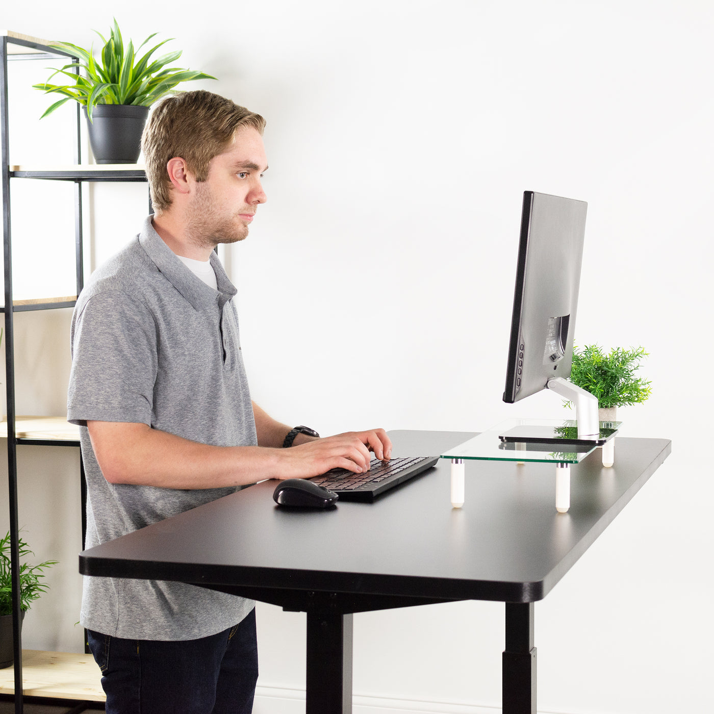 Ergonomic office with black table top.