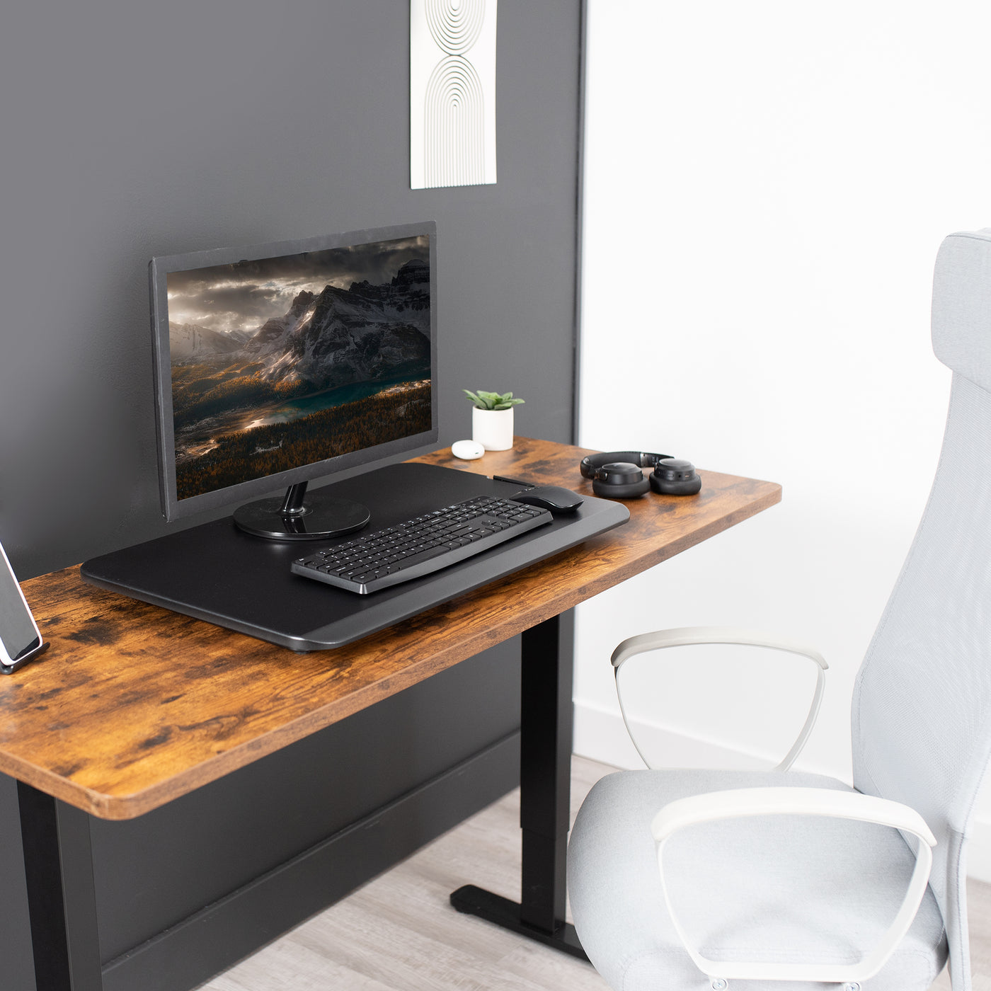 Sleek compact design of a desk converter from VIVO that lays close to the desktop. 