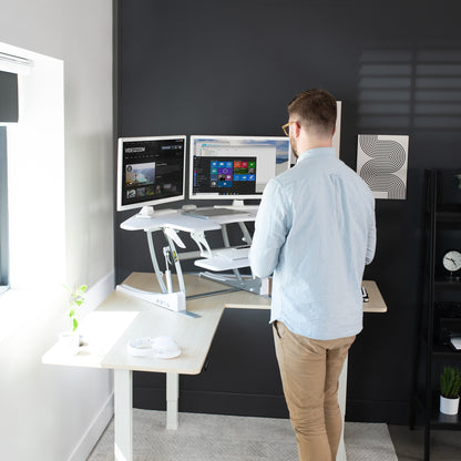 Heavy-duty, white, height adjustable corner desk converter monitor riser with 2 tiers.