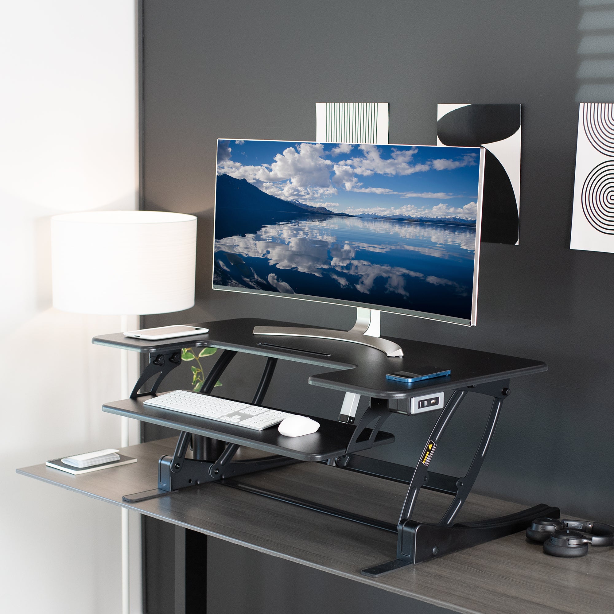 Top view of desk converter on a desk in a furnished office space.