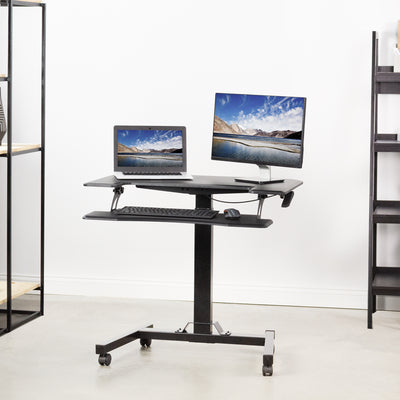 Sit to stand on a pneumatic rolling desk from VIVO.
