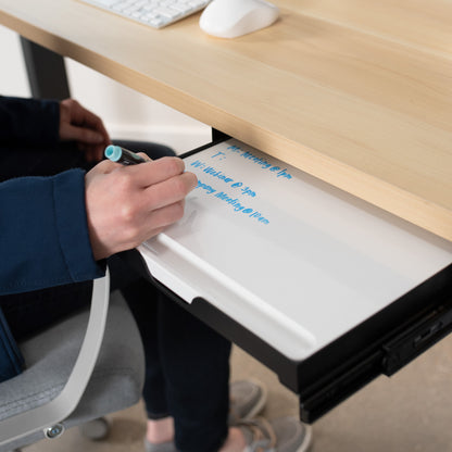 Reduce your desktop clutter and discreetly store important notes with this pull-out dry erase board.