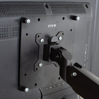 Black sturdy steel VESA plate adapter fitted to align with monitors that are not standard.