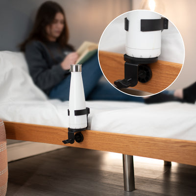 Side of bed with a cup mount to hold a water bottle in a convenient close space.