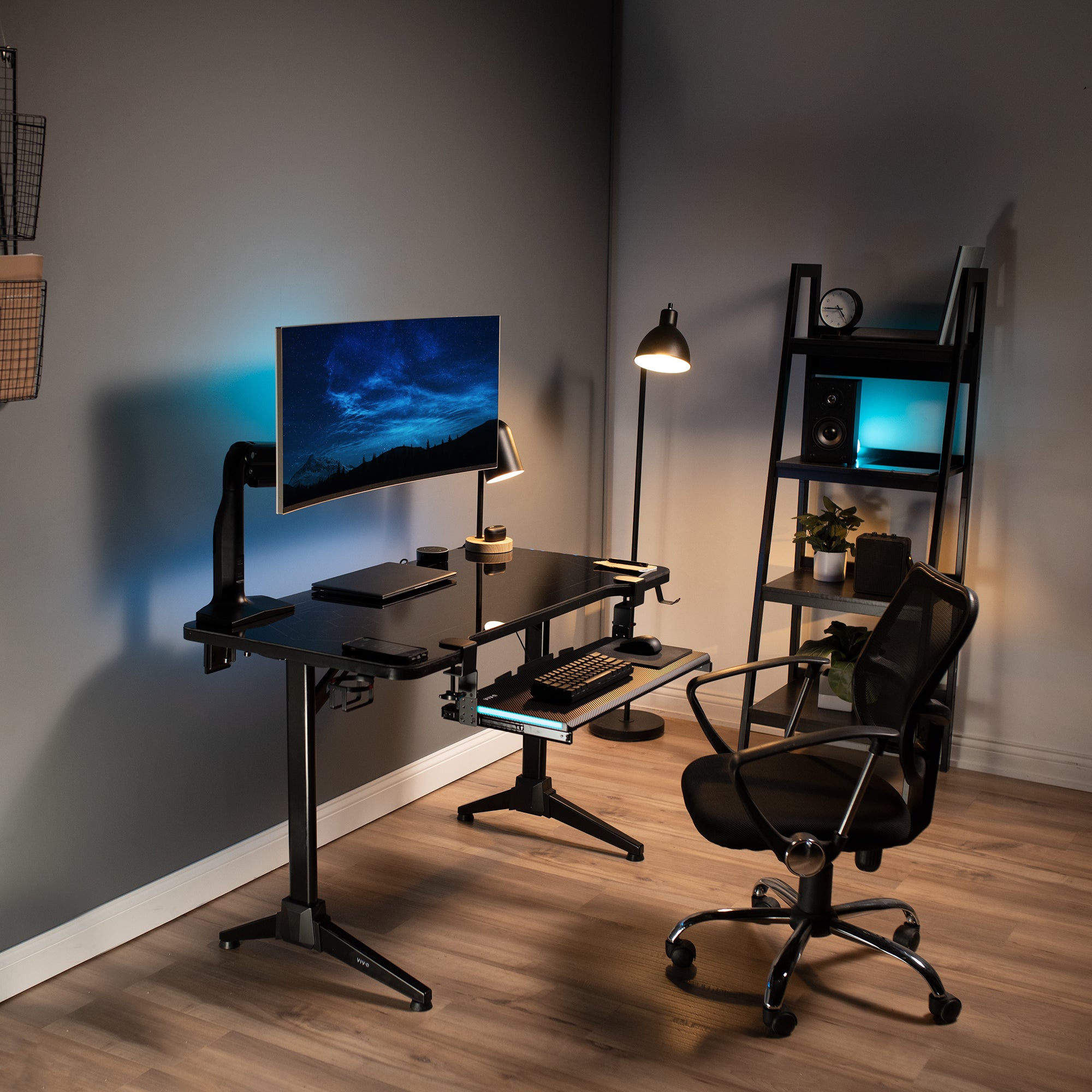 Teal LED sliding under-desk keyboard tray in a modern matching office.