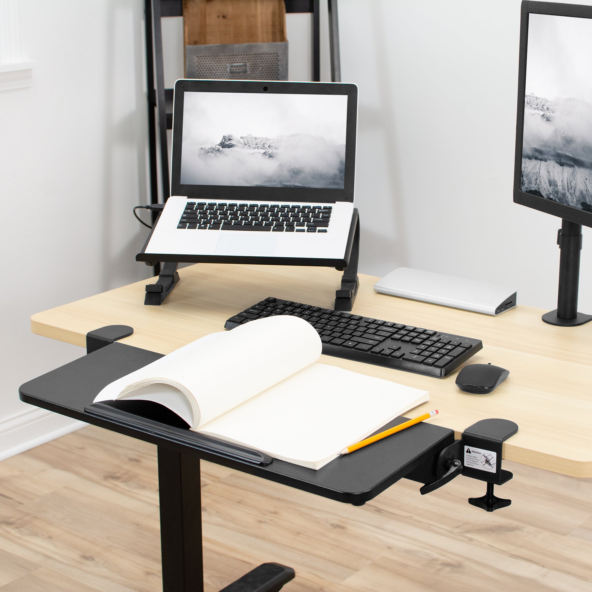 Level clamp on keyboard tray with multiple uses adding desk space.