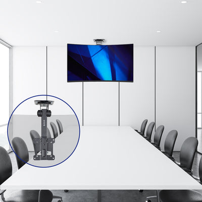 Sturdy flip-down ceiling mount holding a TV in a conference room.