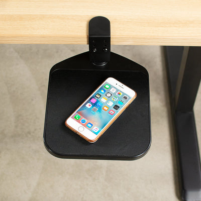 Ergonomic clamp-on desk platform holding a phone for easy access.