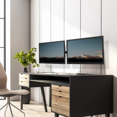 Modern office space with a dual monitor wall mount.