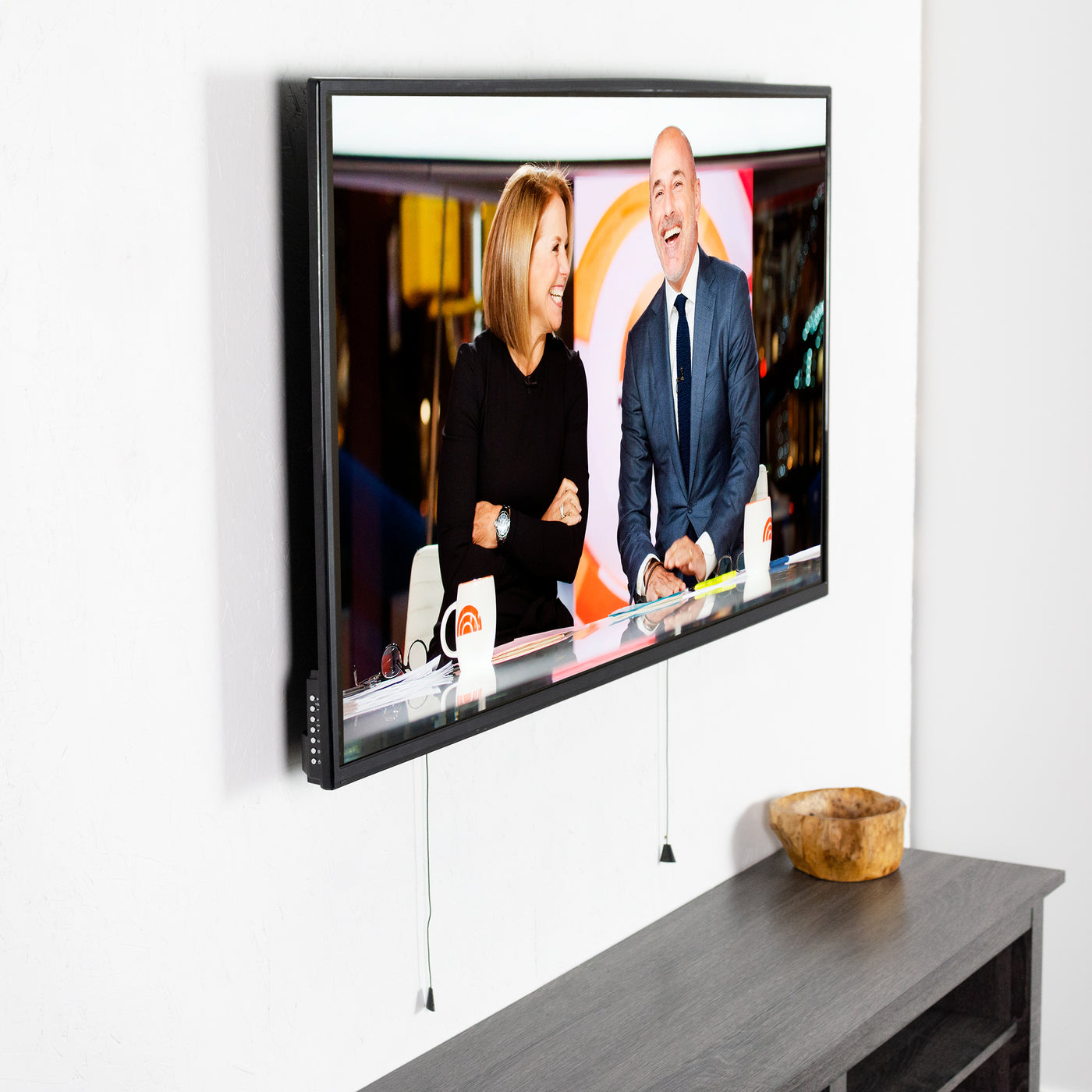 Extra large adjustable TV mount from VIVO above a shelf.