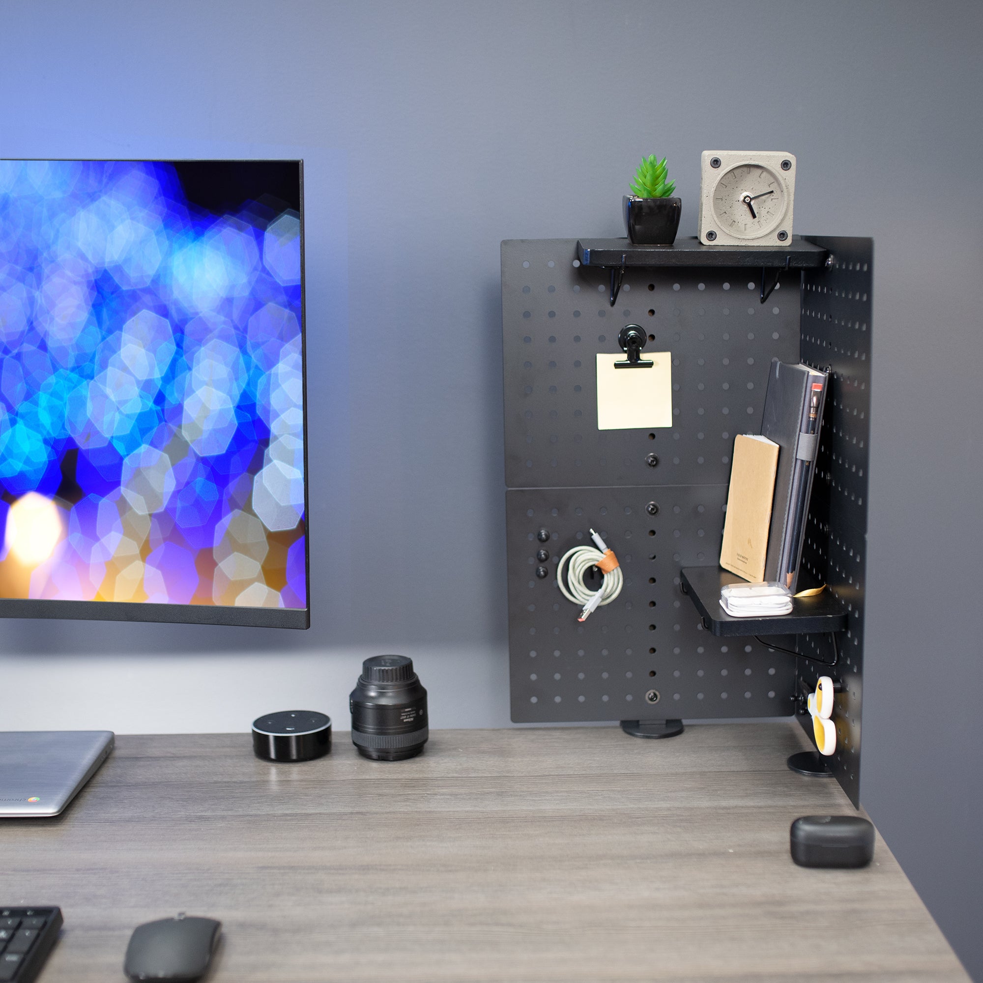 Two clamp-on desk peg boards for an organized workspace.