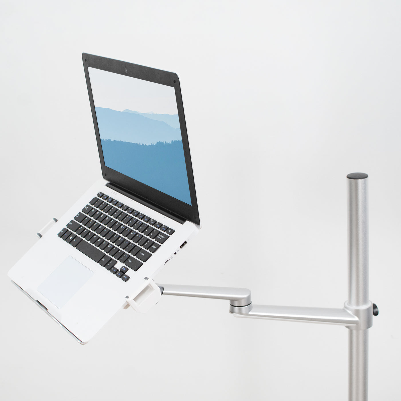 Silver laptop stand supporting an open laptop.