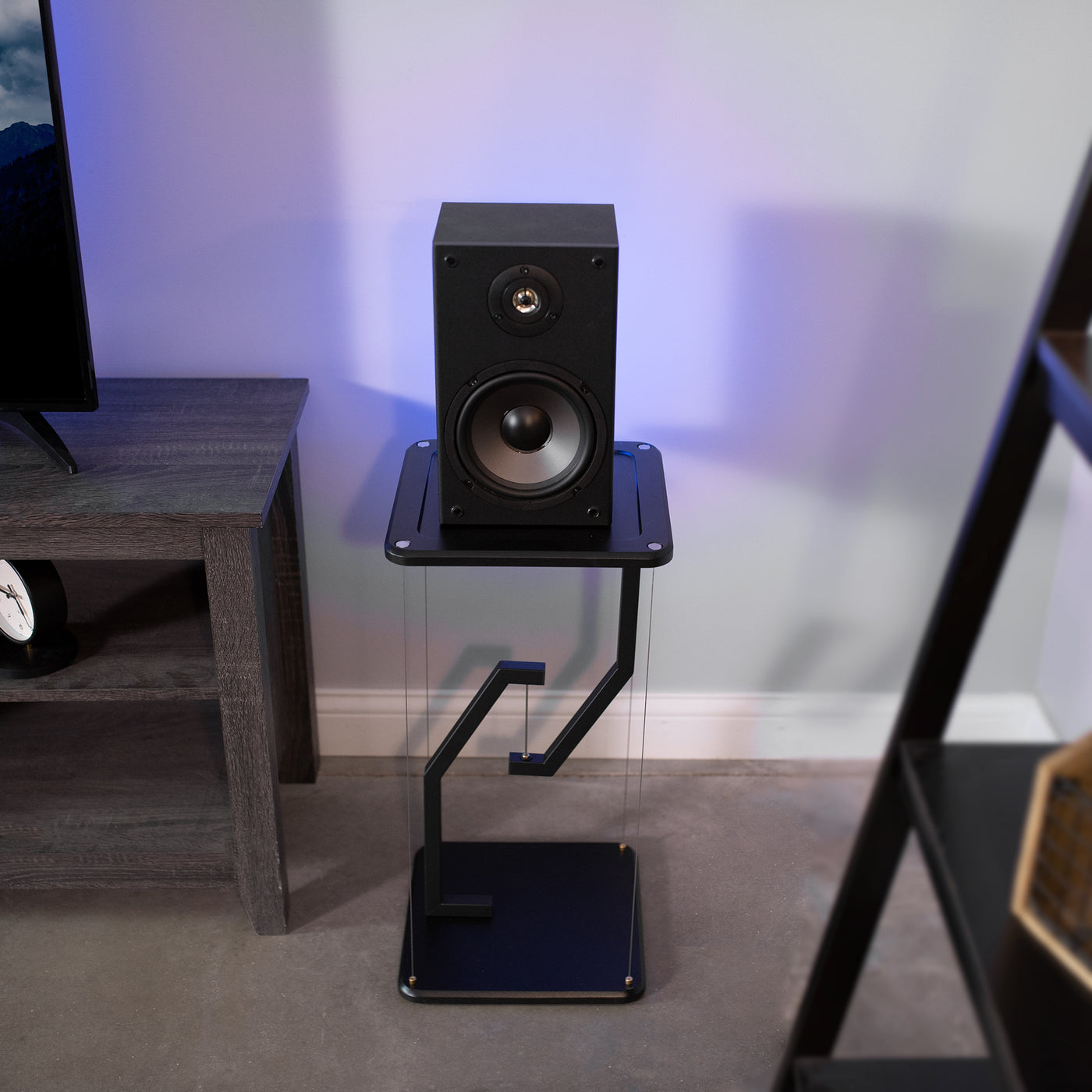 Floating speakers stand for improved sound and aesthetic appeal.