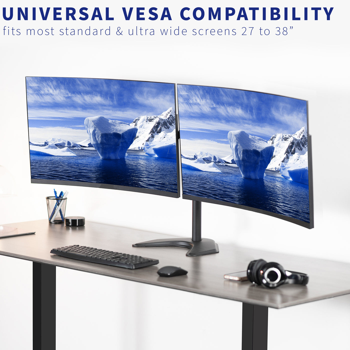 Telescoping adjustable arms of a dual monitor mount supporting most ultrawide screens ranging from 27 to 38 inches.